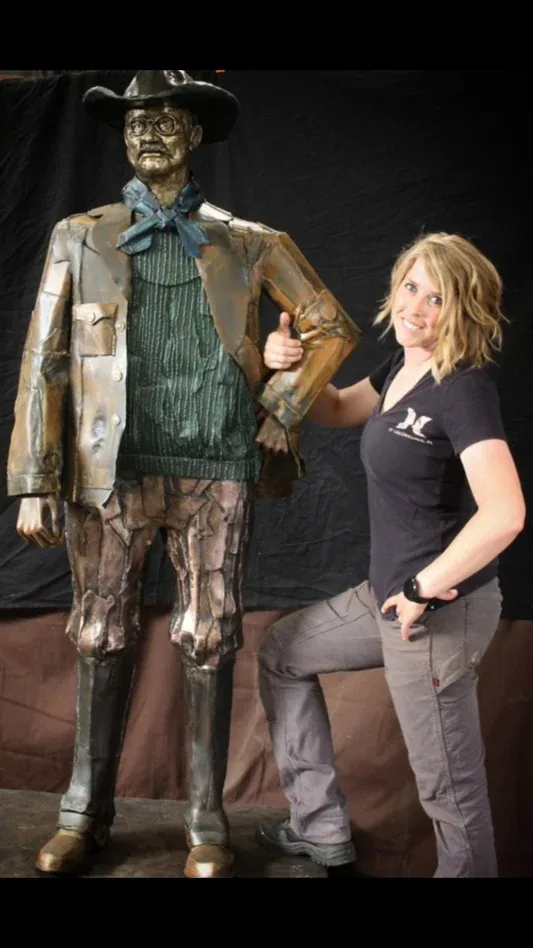 Pair of metal child figure sculptures